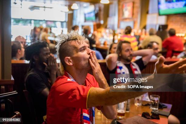 Russian football fan reacts, after the Russians scored a second goal against Croatia in the second overtime to make the score 2-2 and force penalty...