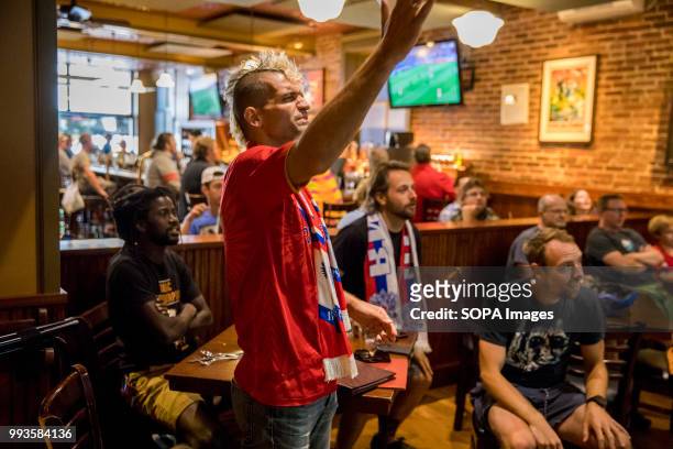 Russian football fan reacts while watching the 2018 World Cup game against Croatia at the Uptown Cafe. Russian lost to Croatia 4-3 in penalty kicks.