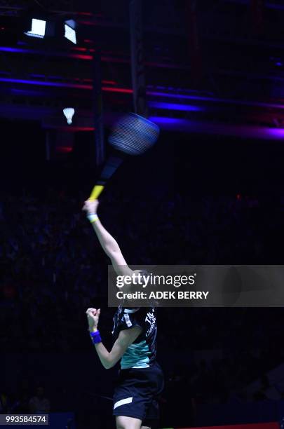 Tai Tzu Ying of Taiwan plays a return against Chen Yufei of China during the women's singles badminton final match at the Indonesia Open in Jakarta...