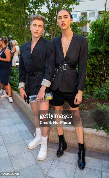 Simon Rechenauer and guest attend the Marcel Ostertag Fashion Show during the Berlin Fashion Week Spring/Summer 2019 in Berlin, Germany on July 4,...