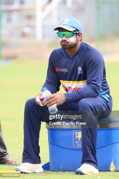 Sri Lanka cricketer Kusal Janith Perera is drinking water at practice session in the R.Premadasa Stadium in Colombo on July 6, 2018. Sri lanka and...