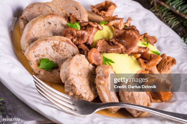 mashed potatoes with pork medallions and chanterelle sauce - mashed stock pictures, royalty-free photos & images