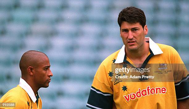 John Eales, Wallaby captain and George Gregan, vice captain, chat at a light training session at the Sydney Football Stadium, Sydney, Australia....