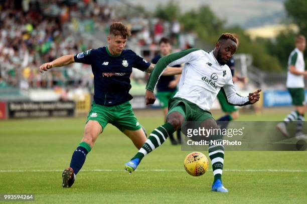 Moussa Dembele of Celtic fights for the ball with Luke Byrne of Shamrock during the Club Friendly match between Shamrock Rovers and Celtic FC at...
