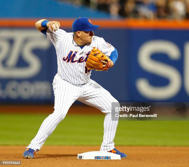 Asdrubal Cabrera of the New York Mets throws to first base in an MLB baseball game against the Pittsburgh Pirates on June 27, 2018 at Citi Field in...
