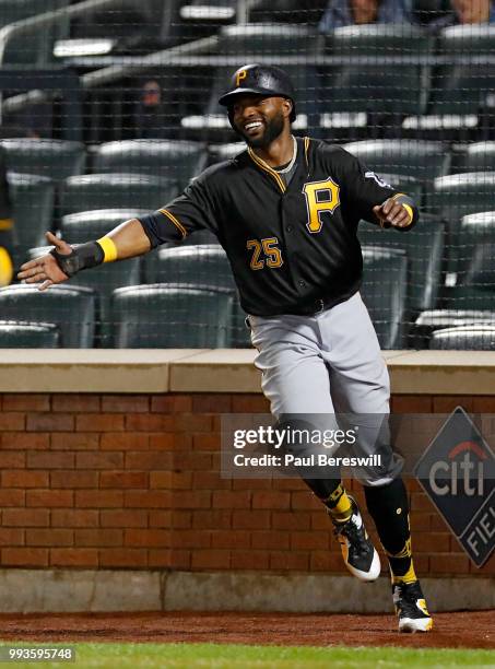 Gregory Polanco of the Pittsburgh Pirates celebrates after scoring a run in the ninth inning in an MLB baseball game against the New York Mets on...
