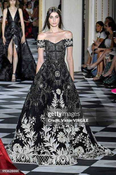 Model walks the runway during the Zuhair Murad Haute Couture Fall Winter 2018/2019 fashion show as part of Paris Fashion Week on July 4, 2018 in...