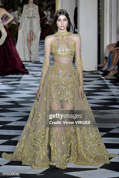 Model walks the runway during the Zuhair Murad Haute Couture Fall Winter 2018/2019 fashion show as part of Paris Fashion Week on July 4, 2018 in...