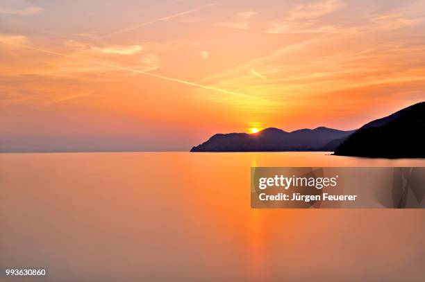 sunset above the sea at cinque terre, view from manarola, italy - terre sol stock-fotos und bilder