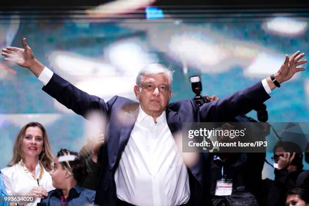 Andres Manuel Lopez Obrador waves as he celebrates his victory on the stage at "Zocalo Square" on July 1, 2018 in Mexico City, Mexico. Presidential...