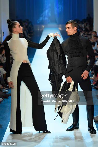 Anna Cleveland and a model walk the runway during the Jean-Paul Gaultier Haute Couture Fall Winter 2018/2019 fashion show as part of Paris Fashion...