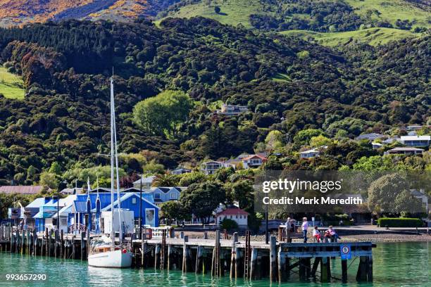 akaroa jetty and waterfront, morning - banks peninsula stock pictures, royalty-free photos & images