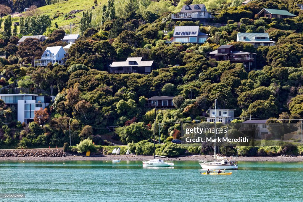 Waterfront of Akaroa Harbour and hillside homes, morning