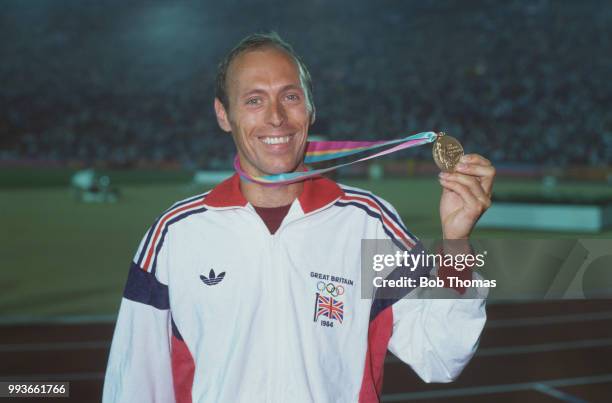 English athlete Mike McLeod of the Great Britain team celebrates after finishing in second place to win the silver medal in the Men's 10,000 metres...
