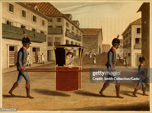 Color print depicting two men of African descent wearing blue and red uniforms, but no shoes, carrying poles supporting a small red and black litter...