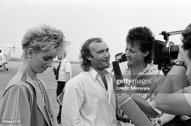 Singer Phil Collins & wife Jill Travelman at London Heathrow Airport, being interviewed by Steve Blacknell. Phil Collins is about to board a Concorde...