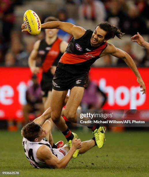 Jake Long of the Bombers and Josh Thomas of the Magpies in action during the 2018 AFL round 16 match between the Essendon Bombers and the Collingwood...