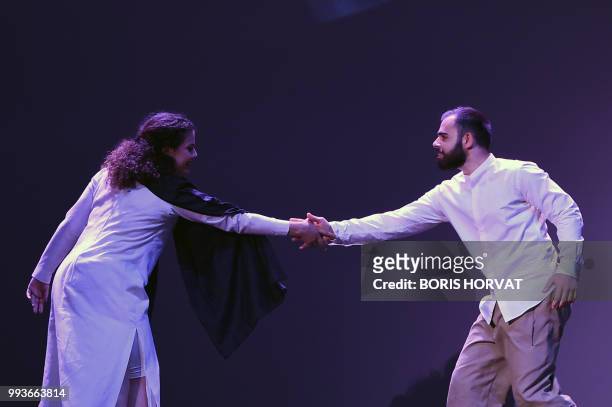 Israeli artist Loay Srouji and Nai Tamish Barghouti perform during the opera 'Orfeo and Majnun' directed by Martina Winkel and Airan Berg and...