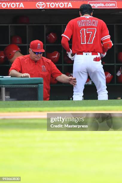 Manager Mike Scioscia and Shohei Ohtani of the Los Angeles Angels of Anaheim looks on during the MLB against the Los Angeles Dodgers at Angel Stadium...