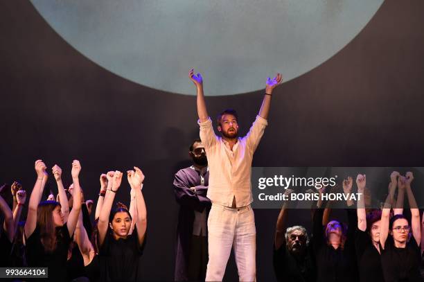 French artist Yoann Dubruque and others perform during the opera 'Orfeo and Majnun' directed by Martina Winkel and Airan Berg and conducted by...