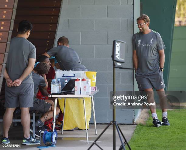 Virgil van Dijk and Georginio Wijnaldum of Liverpool talking with manager of Liverpool Jurgen Klopp during the first day back at Melwood Training...