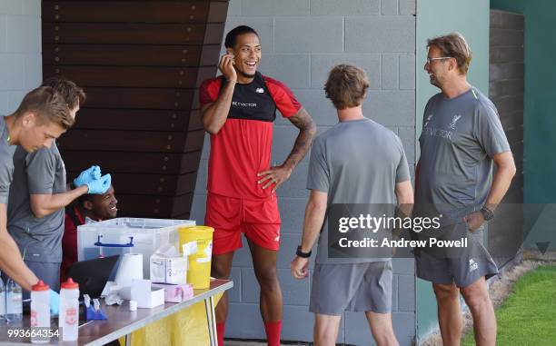 Virgil van Dijk and Georginio Wijnaldum of Liverpool talking with manager of Liverpool Jurgen Klopp during the first day back at Melwood Training...