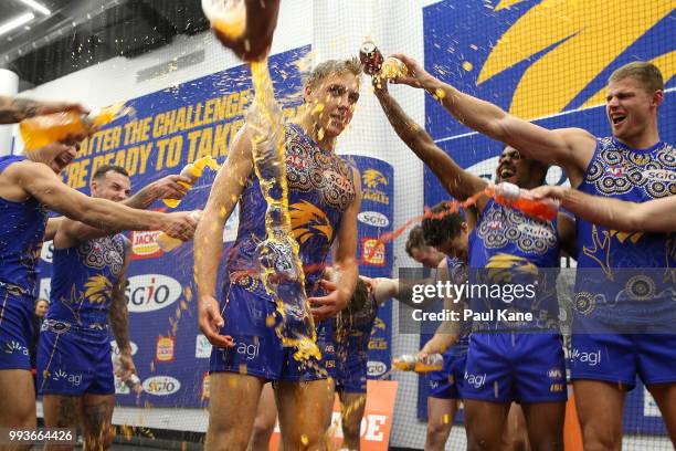 Oscar Allen is showered in sports drinks after winning the round 16 AFL match between the West Coast Eagles and the Greater Western Sydney Giants at...