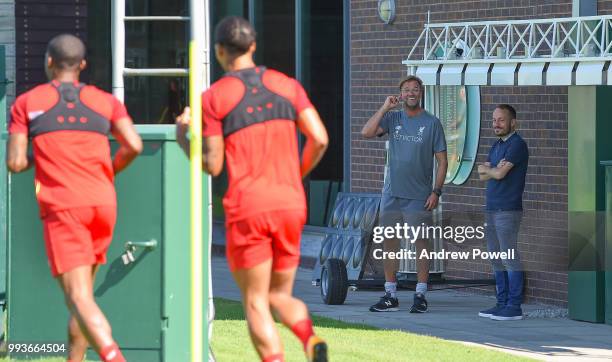 Jurgen Klopp manager of Liverpool laughing with Virgil van Dijk and Georginio Wijnaldum of Liverpool during the first day back at Melwood Training...