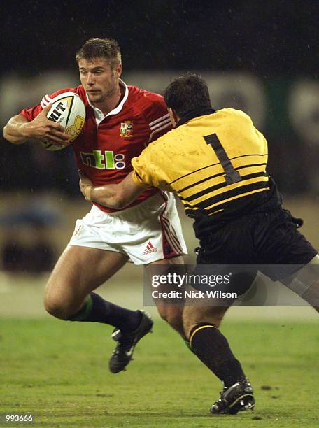 Winger Ben Cohen of the British Lions evades the tackle of prop Dirk Gleghorn of Western Australia during the British Lions match against Western...