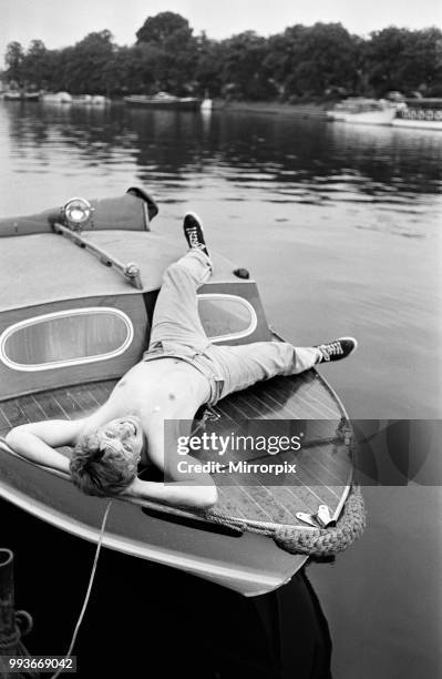 President of Bermondsey Boat Club Tommy Steele relaxes at his Thames side house at Teddington. In his garden he has an old lamppost from Bermondsey...