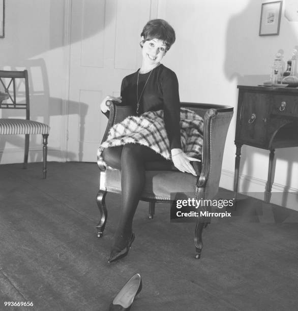 Dancer Una Stubbs, aged 22, in her flat in London, 4th December 1959.