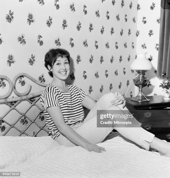 Dancer Una Stubbs, aged 22, in her flat in London, 4th December 1959.