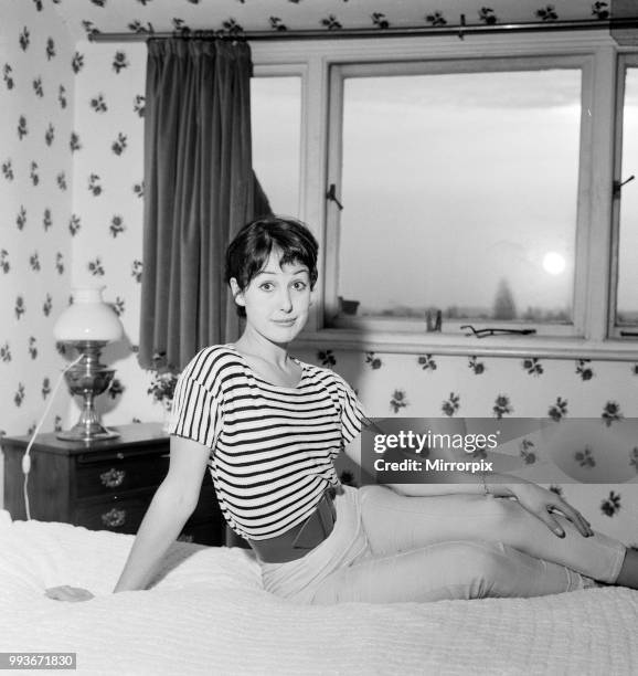 Dancer Una Stubbs, aged 22, in her flat in London, 4th December 1959.