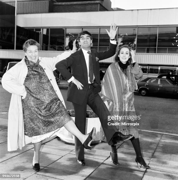Derek Nimmo with Peggy Mount and Paula Wilcox leaving Heathrow Airport for the Middle East where they are to be in a Noel Coward show 'Blythe Spirit'...