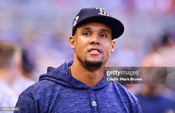 Carlos Gomez of the Tampa Bay Rays looks on in the dugout before the game against the Miami Marlins at Marlins Park on July 3, 2018 in Miami, Florida.