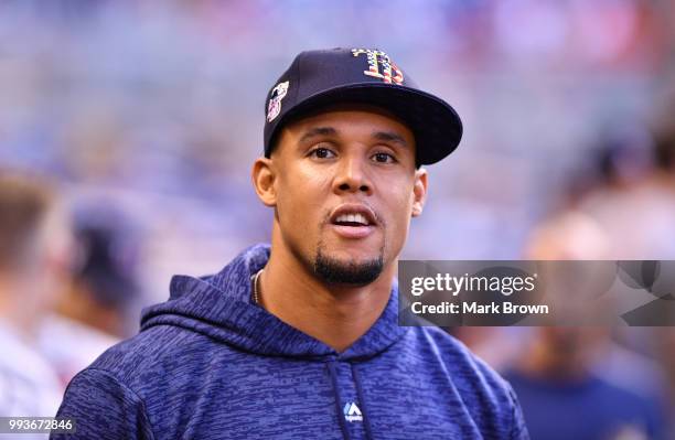 Carlos Gomez of the Tampa Bay Rays looks on in the dugout before the game against the Miami Marlins at Marlins Park on July 3, 2018 in Miami, Florida.