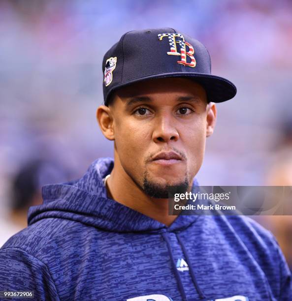Carlos Gomez of the Tampa Bay Rays looks on in the dugout before the game against the Miami Marlins at Marlins Park on July 3, 2018 in Miami, Florida.