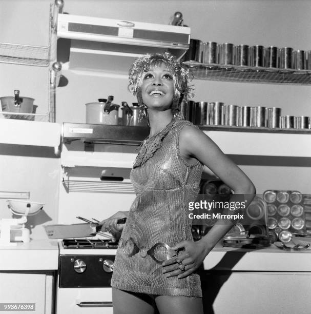 Daily Mail Ideal Home Exhibition, Olympia. Model, Valerie St Helene from Curacao, on the British Steel Corporation stand, dressed in a steel wig, a...