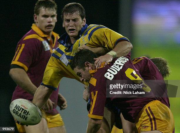Jody Gall of City is tackled by Danny Buderus of Country during the NRL Origin match between Country and City held at Carrington Park, Bathurst,...