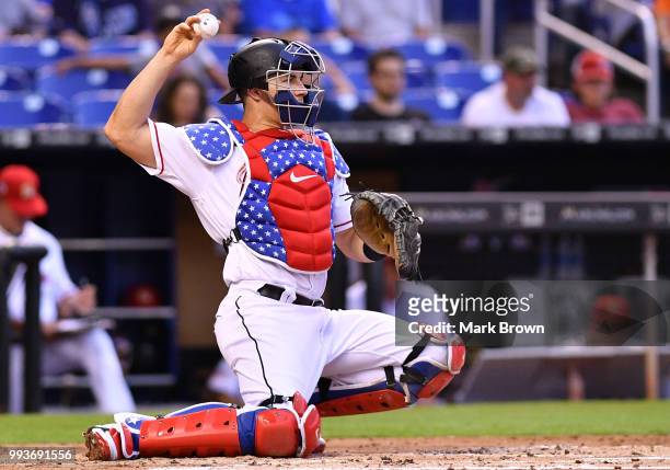 Detailed view of the Stars and Stripes chest protector of J.T. Realmuto of the Miami Marlins against the Tampa Bay Rays at Marlins Park on July 3,...