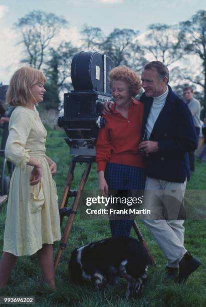 English actress Hayley Mills with her parents John Mills and Mary Hayley Bell on the set of romantic drama film Sky West and Crooked,...