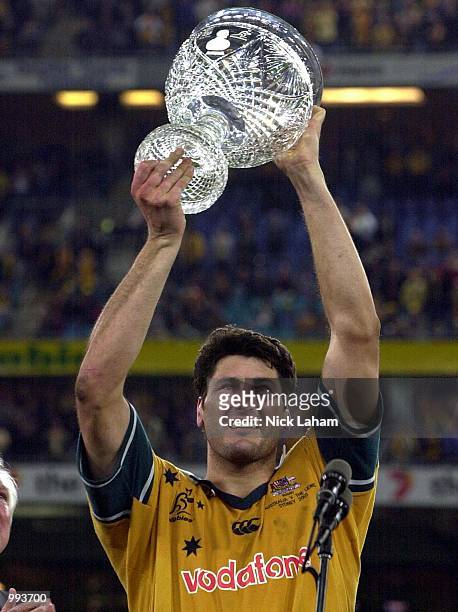 John Eales of the Wallabies holds the Tom Richards cup aloft the Wallabies victory over the Lions during the third Test Match between the Australian...