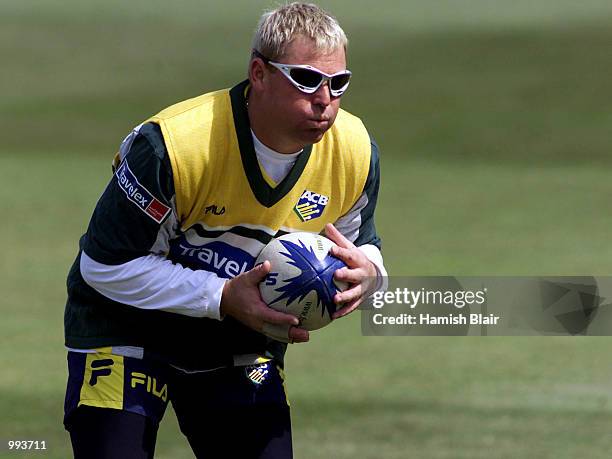 Shane Warne of Australia catches a rugby ball, during training at Glamorgan County Cricket Ground, Cardiff, Wales. DIGITAL IMAGE Mandatory Credit:...