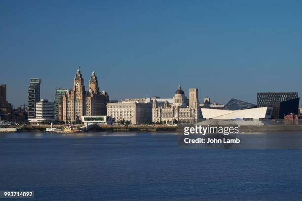 liverpool waterfront, with royal liver, cunard and port of liverpool buildings - classical mythology character stock-fotos und bilder