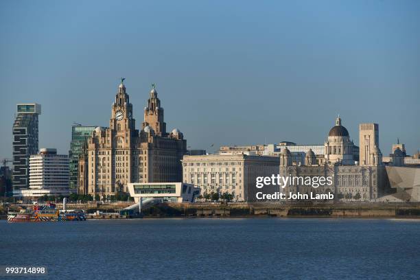 liverpool waterfront, with royal liver, cunard and port of liverpool buildings - classical mythology character stock-fotos und bilder