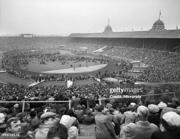 American evangelist Billy Graham speaking at Wembley Stadium during the final meeting of his three month London crusade, 23rd May 1954.