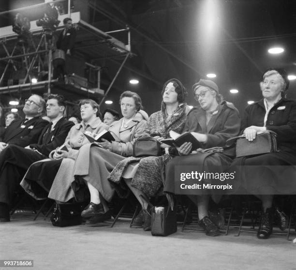 American evangelist Billy Graham addressing a huge crowd of people at Kelvin Hall in Glasgow, Scotland during his Scottish Crusade, 23rd March 1955.