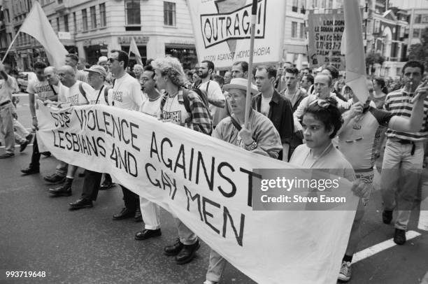 Members of the British LGBT rights group, OutRage Marching with a banner reading 'Stop Violence Against Lasbians And Gay Men', at the Lesbian and Gay...