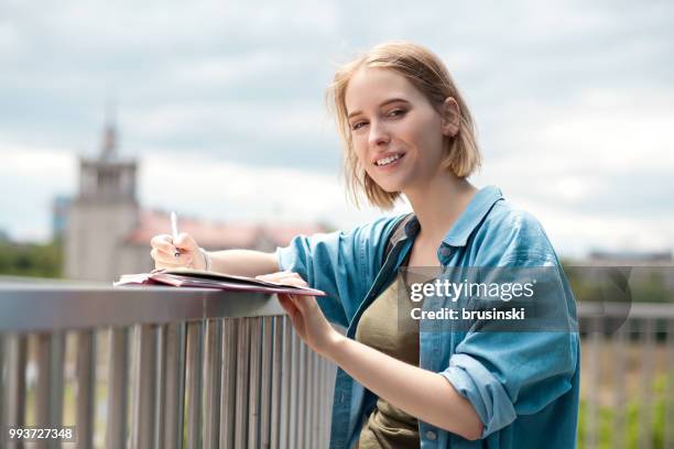 a young attractive woman of 20 years draws in a sketchbook - 20 24 years photos stock pictures, royalty-free photos & images