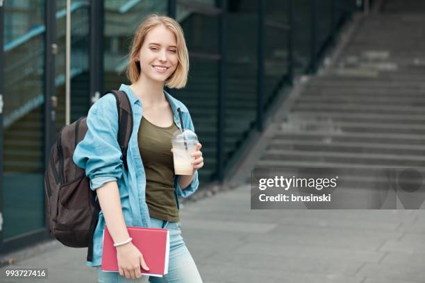 portrait of a young attractive female student 20 years old with a backpack - 20 24 years stock pictures, royalty-free photos & images